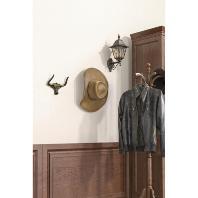 Porte-chapeaux mural en fonte, lot de 2, doré. Corne profonde et recourbée pour un maintien optimal du chapeau. Construction monobloc robuste, résistante à la rouille.