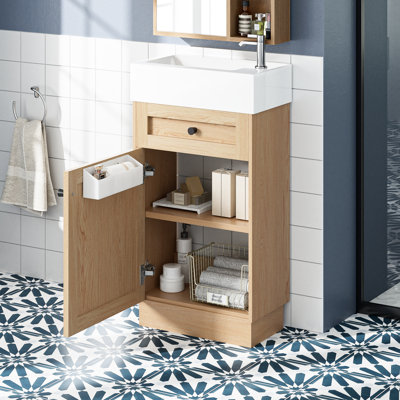 Meuble-lavabo rustique de 18,5 po avec lavabo réversible en résine, armoires intégrées, tablettes réglables pour optimiser l'espace, poignées, finition grain de bois, portes à fermeture silencieuse de style rustique