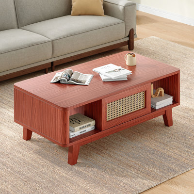 Table basse moderne Mid-Century avec tiroir en rotin et rangement, idéale pour organiser les essentiels du salon et ajouter de l'élégance
