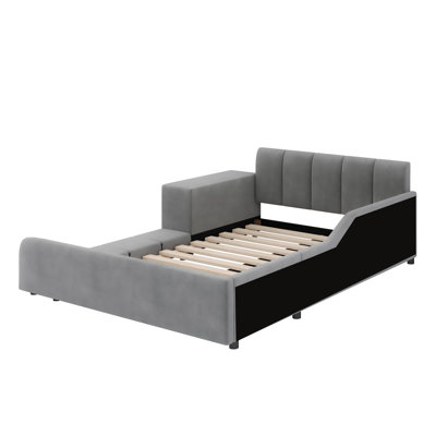Lit tapissier au sol, lit d'enfant avec bureau de chevet et petit tabouret rond