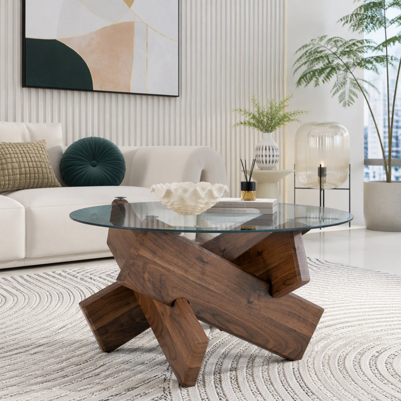 Table basse ronde artistique en forme de croix avec plateau en verre trempé gris fumé et piètement en MDF à motif noyer