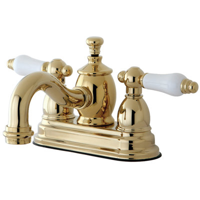 Kingston Brass English Country Two-Handle 3-Hole Deck Mount 4" Centerset Bathroom Faucet with Brass Pop-Up