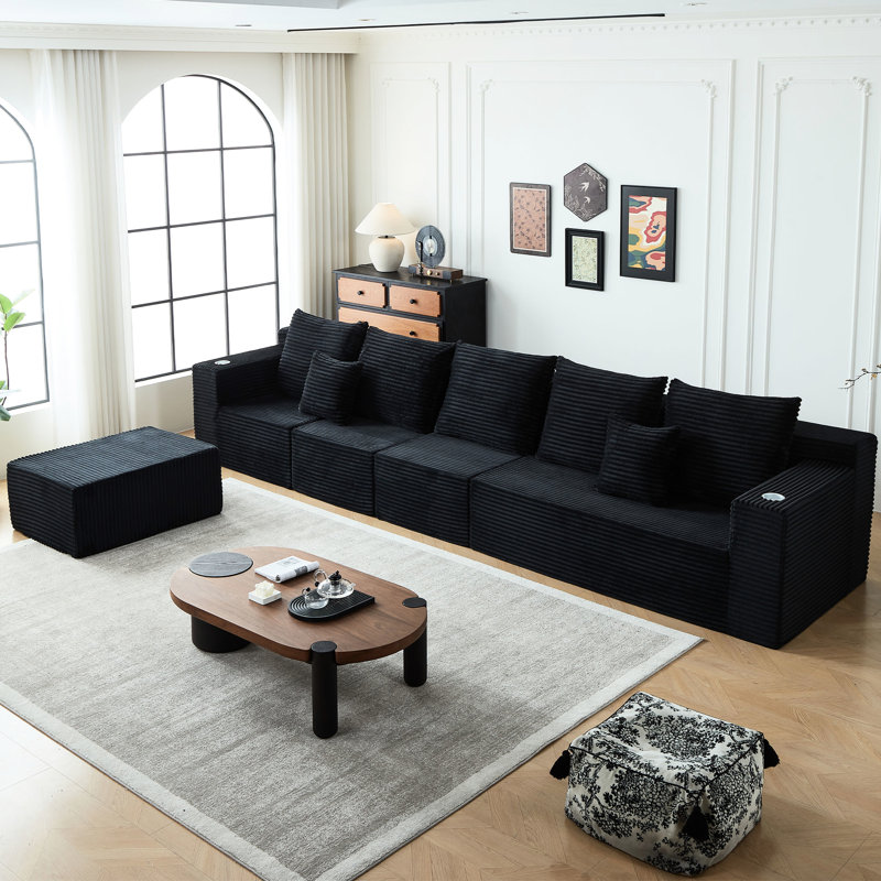 Canapé Deep Cloud 6 en velours côtelé noir avec porte-gobelets, parfait pour un décor moderne. Inspiré par le canapé, les coussins rembourrés et le revêtement doux. Multicolore intégré 11 po