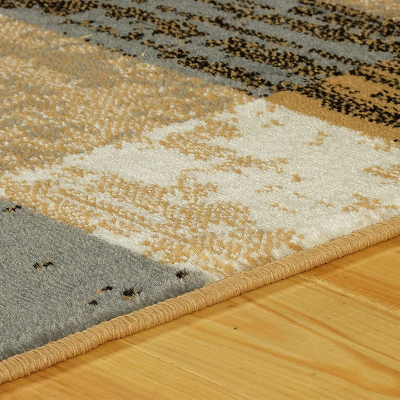 Tapis bleu clair et beige tissé à la machine