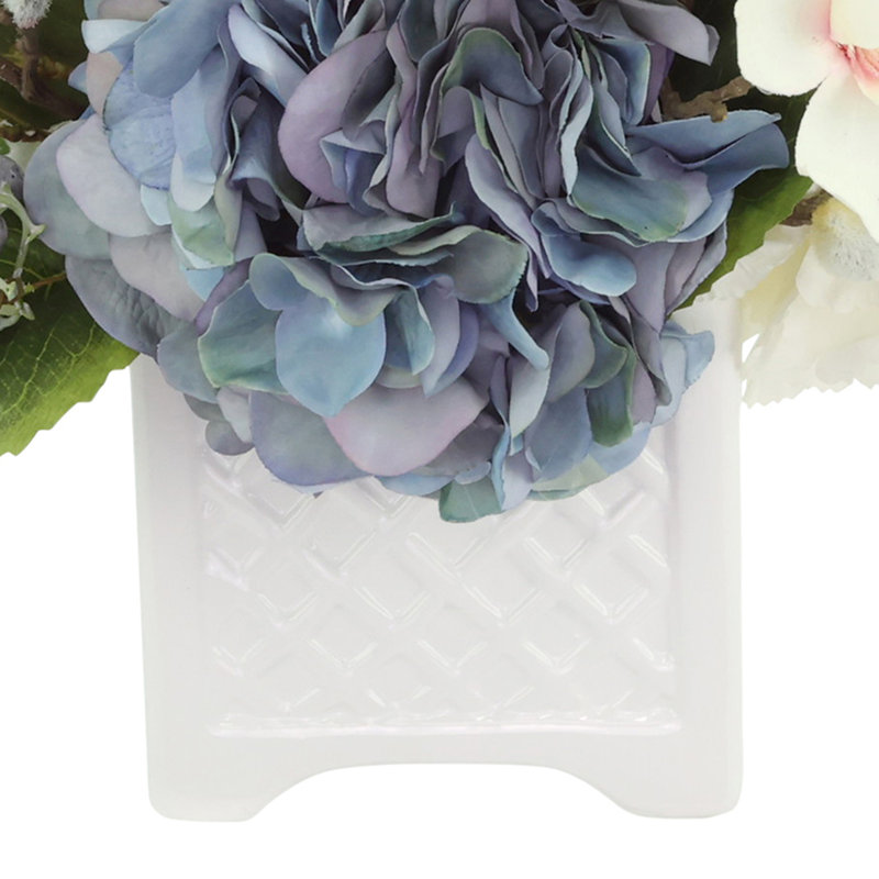 Hydrangea, Berris and Magnolia Arranged in a Ceramic Pot