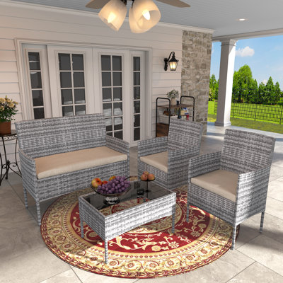 Ensemble de conversation de patio 4 pièces, causeuse et chaises en osier avec coussins imperméables en PE, mobilier d'extérieur avec table basse en verre trempé, cadre toutes saisons pour jardin porche, beige