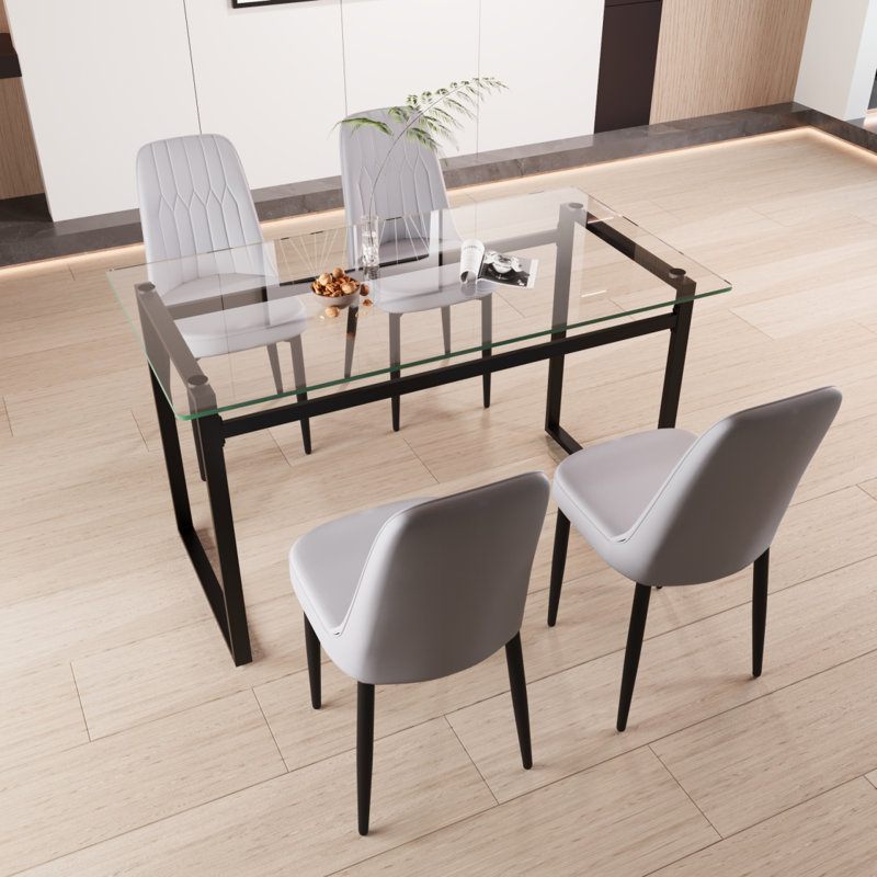 Ensemble de table de salle à manger 51 "pour 4 personnes en verre, ensemble de cuisine avec table et chaises à pieds en métal noir, plateau de table rectangulaire moderne en verre trempé et chaise de salle à manger rembourrée en polyuréthane épais