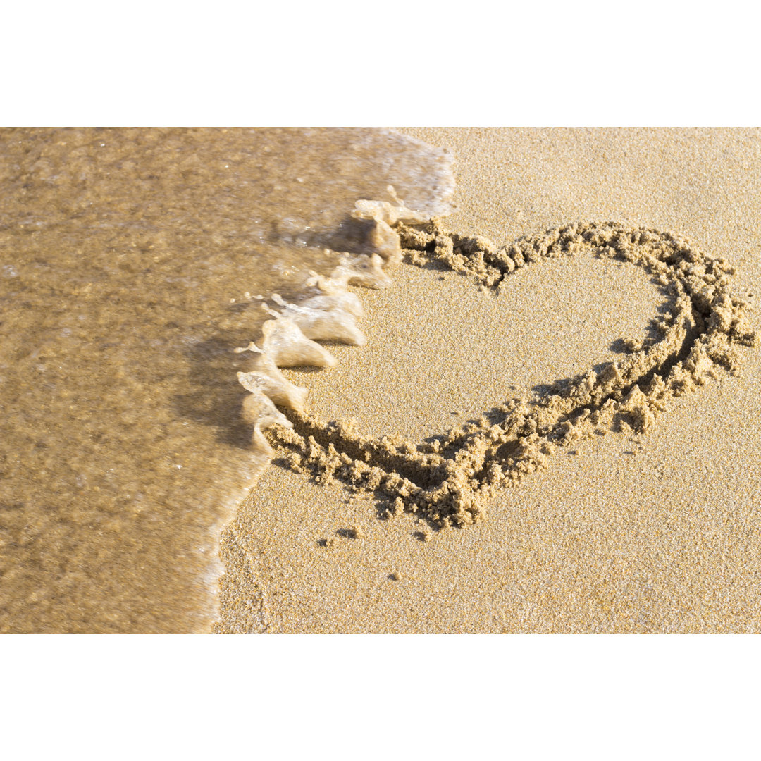 Heart Drawn On Sand by Tatiana - Wrapped Canvas Print