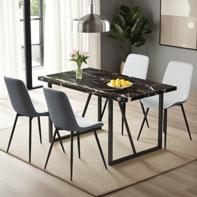 Ensemble de table de salle à manger en marbre noir, table de 55 po avec 4 coussins en polyuréthane pour des espaces de salle à manger élégants