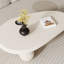 51" Oval Cream Black Brown Modern Coffee Table with Three Round Legs-380611240-386510971
