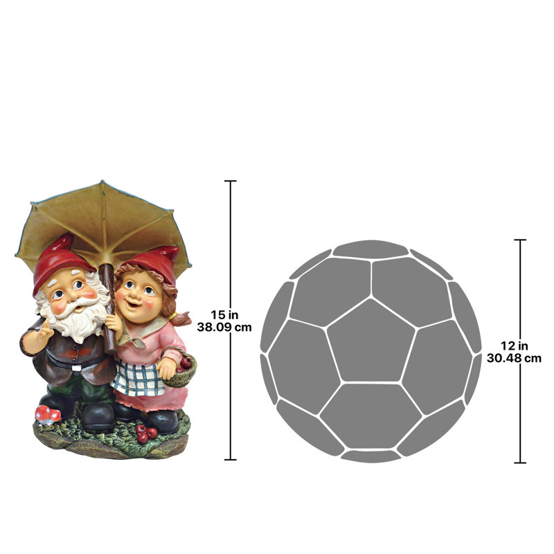 Statue de jardin gnomes sous un parapluie jour pluvieux