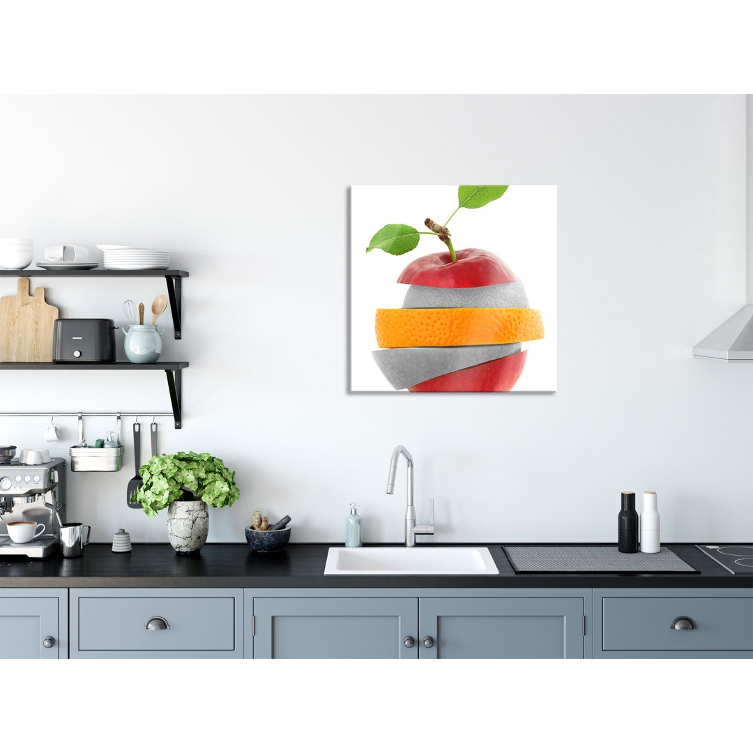 Glasbild Fruchtmischung aus Apfel, Orange, Limette