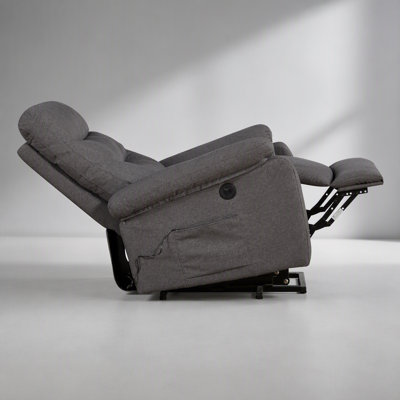 Fauteuil releveur contemporain avec revêtement en tissu gris, fonction de relevage et inclinaison électriques pour un confort et une mobilité optimaux.