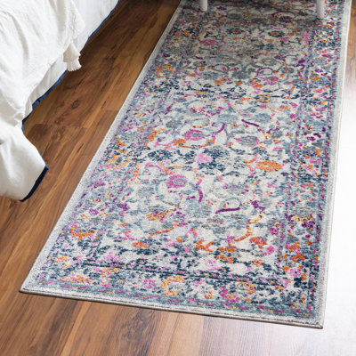 Tapis ivoire à motif floral