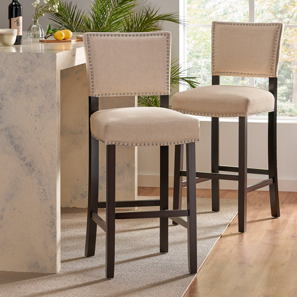 Taburete de bar tapizado Tewksbury con estructura de madera maciza