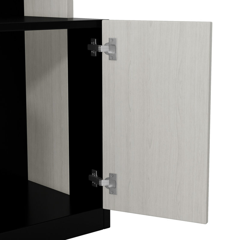 Lit double noir + blanc avec tablettes de rangement et fonction de bureau pour optimiser l'espace