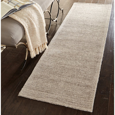 Tapis beige uni touffeté à la main