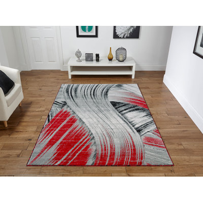 Tapis gris / rouge à motif abstrait