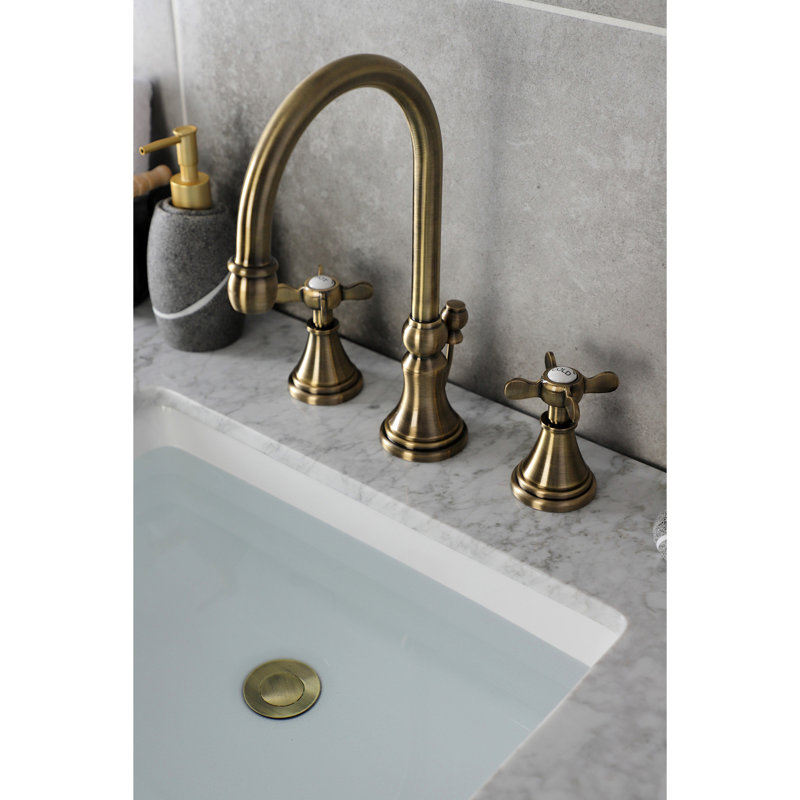 Kingston Brass Essex Two-Handle 3-Hole Deck Mount Widespread Bathroom Faucet with Brass Pop-Up Drain, Antique Brass