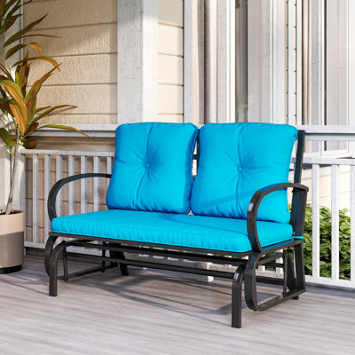 Chaise berçante d'extérieur en métal avec coussins