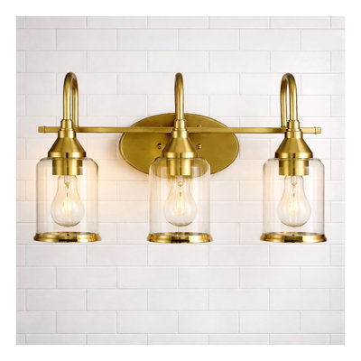 Luminaire de salle de bain contemporain à trois lumières Twilight en or brossé avec verre transparent