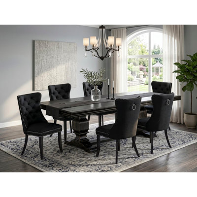7-piece kitchen set includes a consists of table and 6 Black Polyester fabric modern chairs with Button Tufted Chair Back - Sand Blasting Black Finish.