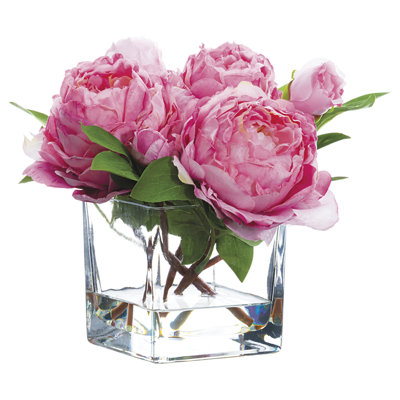 Pivoine artificielle dans un vase en verre