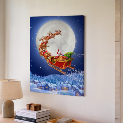 Toile, une scène hivernale fantaisiste mettant en vedette le père Noël dans un art mural animé traîneau rouge tiré par huit rennes, ornée d'art festif sur toile