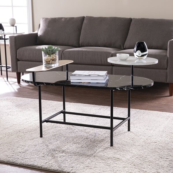 Janel 4 Legs Coffee Table with Storage Ivy Bronx Color: Black