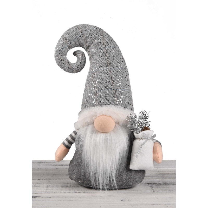 Figurine gnome debout portant un sac-cadeau