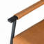 Chaise rembourrée en similicuir avec support en métal noir