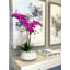 Orchids In A White Container With Rocks