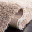 Tapis à poil long de couleur unie Performance Angeliya-57406039