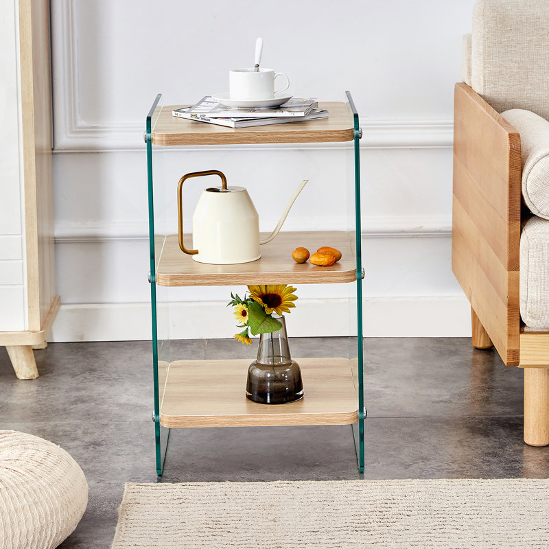 Trois niveaux de tables de chevet. La surface du panneau est en panneau de fibres à densité moyenne, avec des autocollants, et les deux côtés sont en verre trempé transparent. La conception est simple et généreuse, avec une fonction de rangement. 1