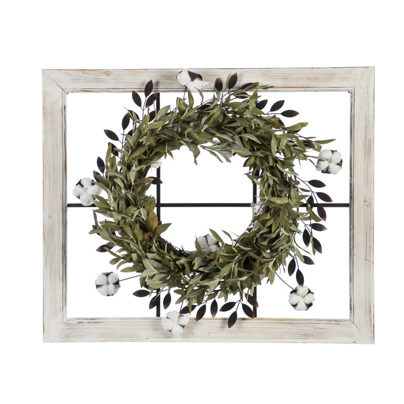 Metal Faux Wreath On Window Frame