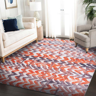 Tapis décoratif à motif géométrique orange et gris