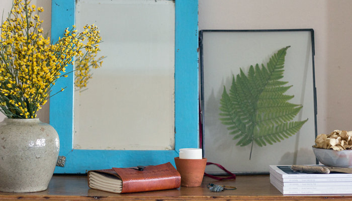 A beautifully decorated shelf space in a peaceful bedroom