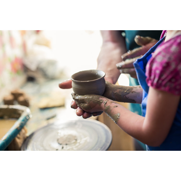 Girl Holding A Clay Bowl Made on Sculpting Wheel by Lyosha Nazarenko - Wrapped Canvas Photograph Ebern Designs Size: 20 H x 30 W x 1.25 D