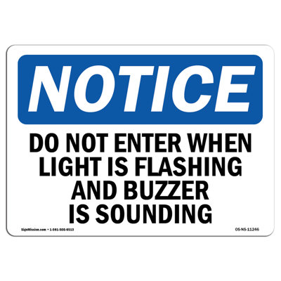 Do Not Enter When Light Is Flashing and Sign