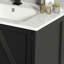 Meuble-lavabo noir, avec lavabo à DEL, portes à fermeture douce et support de rangement.