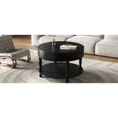 Table basse ronde noire de 80 cm avec plateau rabattable et rangement, tablette inférieure ouverte pour la décoration, montage facile en 10 minutes, finition laquée, idéale pour le salon, double espace de rangement, compartiment caché pour magazines.