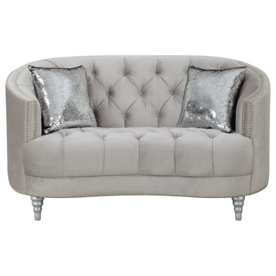 Causeuse contemporaine avec capitonnage