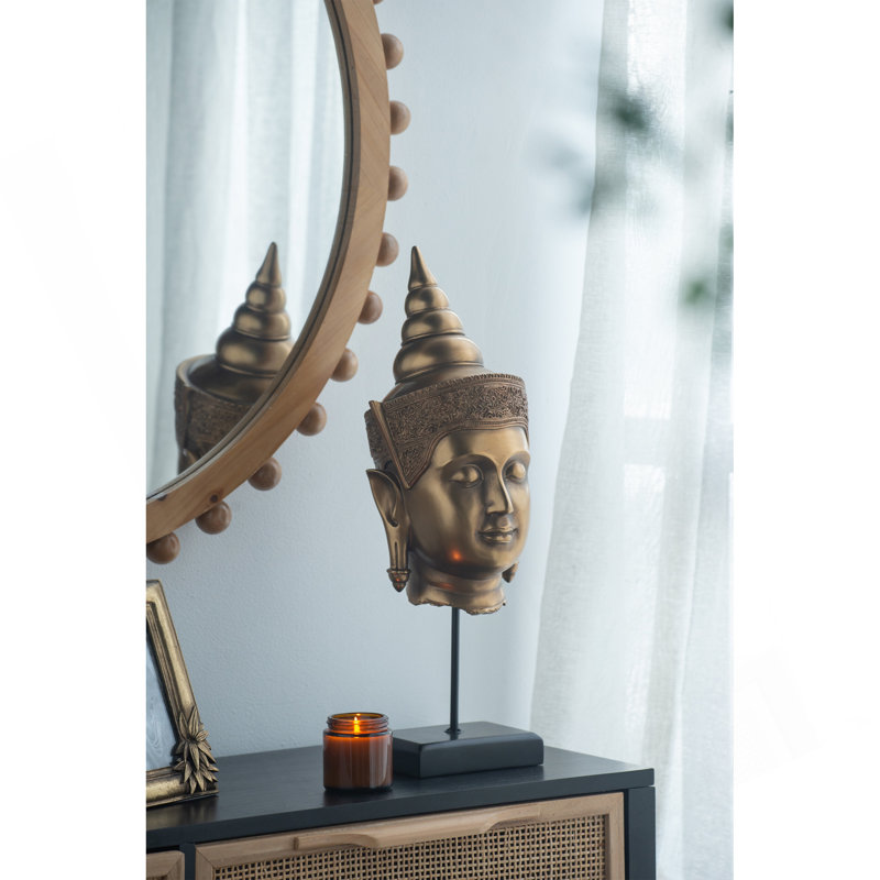 Tête de statue de Bouddha sur pied