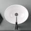 Lavabo de salle de bain ovale en porcelaine vitrifiée blanc