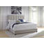 Grand lit tapissier avec commode et table de chevet Dolante