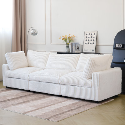 Canapé modulaire rembourré à accoudoirs larges