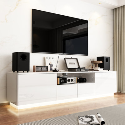 4-Drawer TV Stand With Glossy Finish And Warm Lights by Wrought Studio