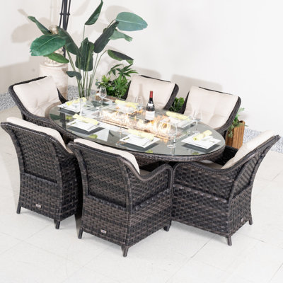 Omied 6 - Person Wicker Patio Dining Set With Oval Table , Cushions Included