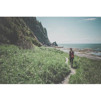 Woman Hiker Walking On A Trail by Onfokus - No Frame Print on Canvas