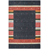 Hand Knotted Wool Area Rug in Black/Red/Green/Ivory